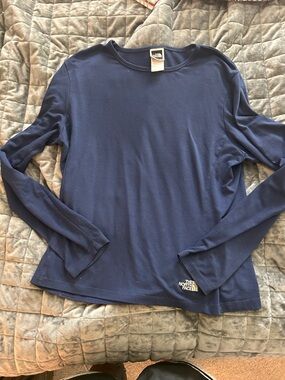 The North Face Navy Long Sleeve Crew Polyester and spandex!